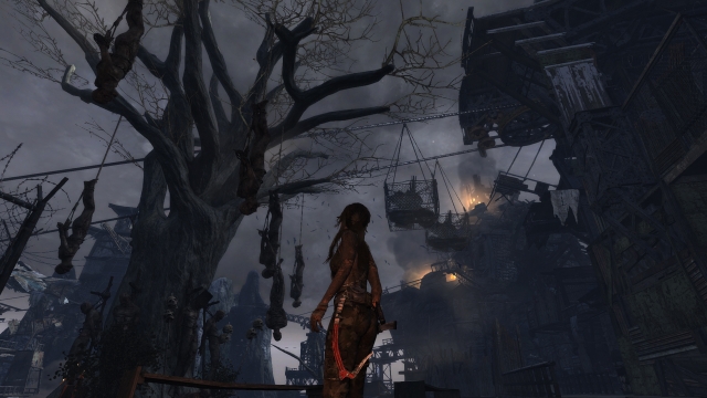 Lara Croft and corpses hanging from a tree.