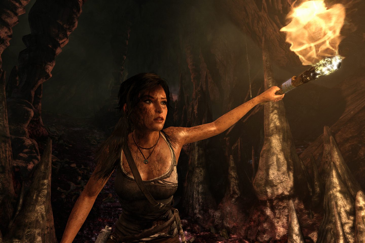 Lara Croft explores a cave.