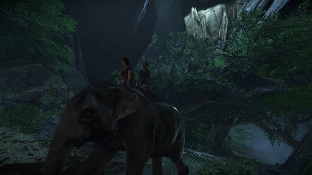 Chloe and Nadine riding an elephant.