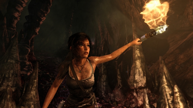 Lara Croft explores a cave.